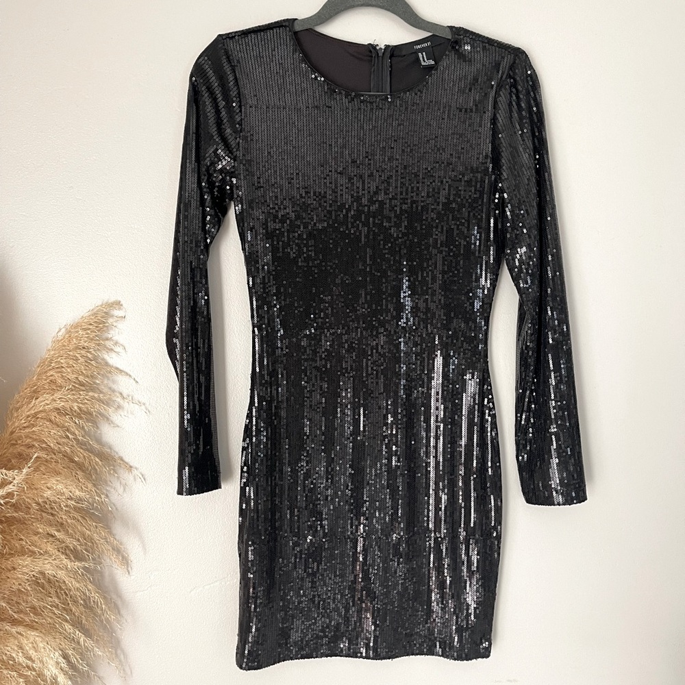 Forever 21 black sequence dress. Worn once to Vegas.